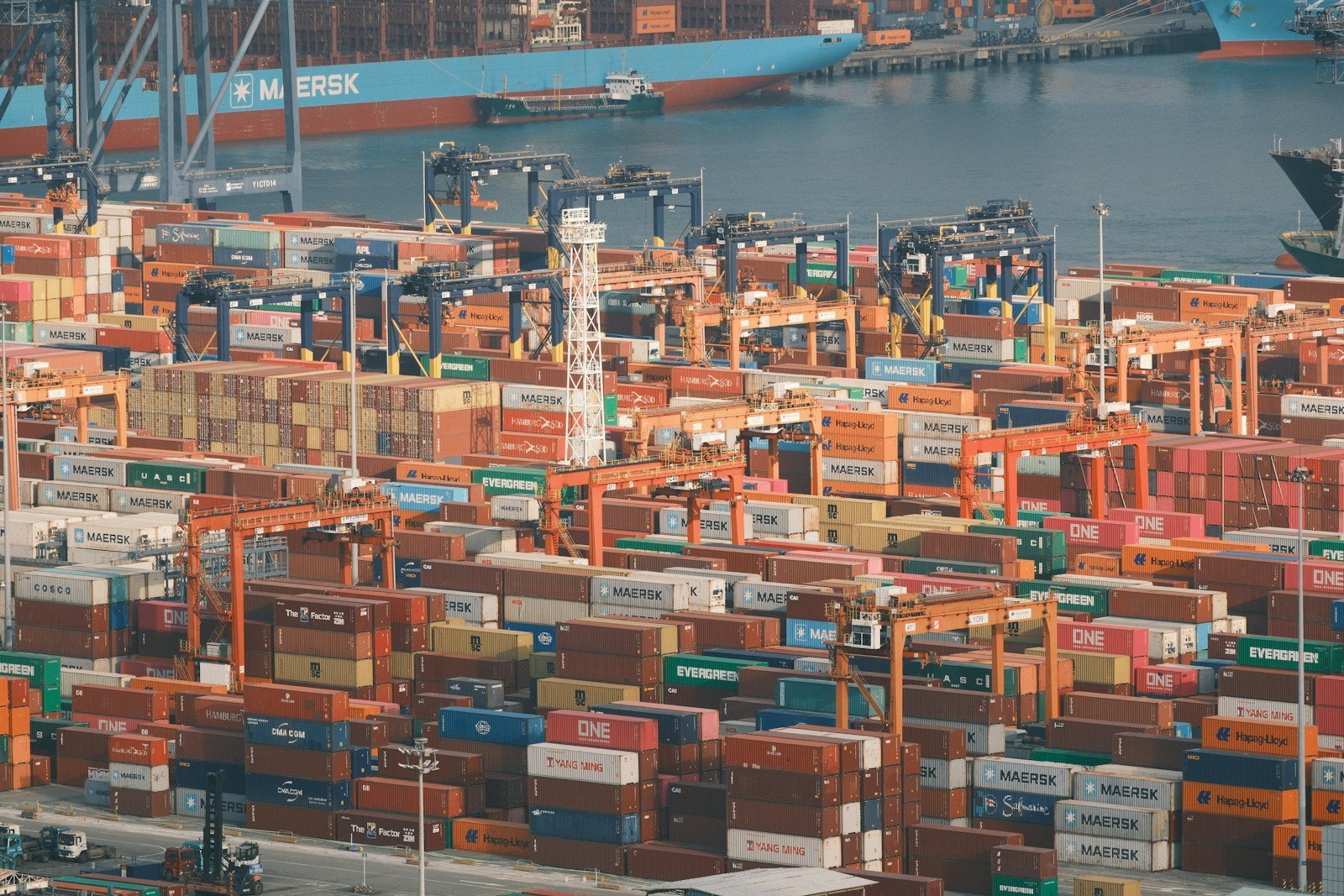 Shipping containers and cranes at a busy port