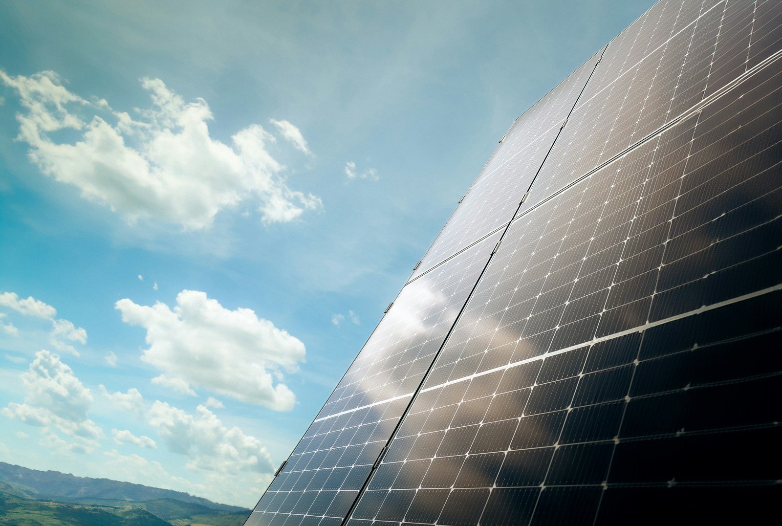 Solar panels beneath a blue sky